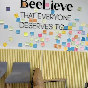 a wall with post - it notes on it