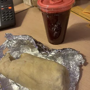 Breakfast burrito and fresh tropical juice.