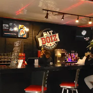 two people sitting at a bar