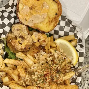 a basket of food with a sandwich and fries