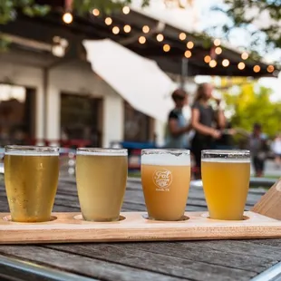 a flight of beers on a table