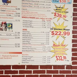 a menu on a brick wall