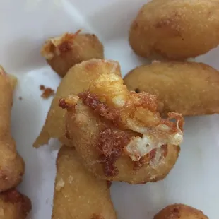 a plate of fried doughnuts