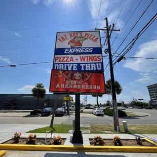 a sign for a drive thru restaurant