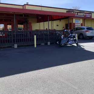 View of front of building and outdoor covered patio.