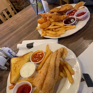 Fried Catfish with fries and toast Chicken tenders fried shrimp and fries and onion rings