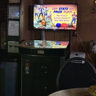 a man playing a game in a bar