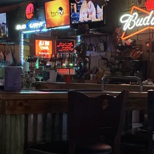 a bar with neon signs