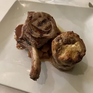 Heritage Breed Pork Chop*, Goat Cheese Bread Pudding, Golden Apple Sauce, Grilled Onion