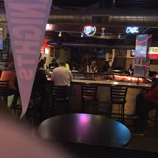 people sitting at the bar