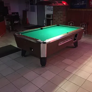 a pool table with a green cloth