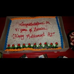 a large sheet cake with the words congratulations on it