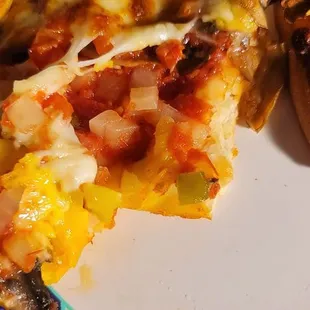 a half eaten pizza on a plate