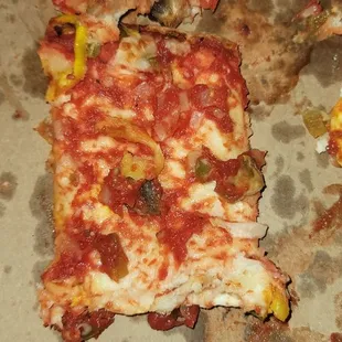a half eaten pizza in a box