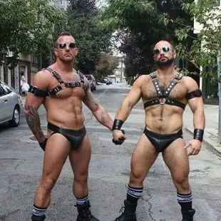 two men dressed in leather