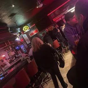 a group of people at a bar