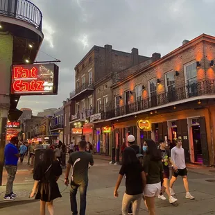 a group of people walking down a street