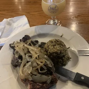 Ribeye with mushrooms and sautéed onions and rice.