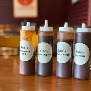 four bottles of bbq's barbecue sauce