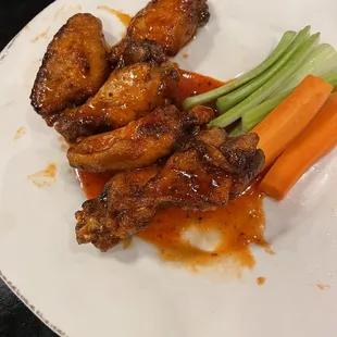 Half eaten honey sriracha wings