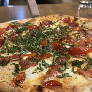 Make your own Pizza with pepperoni tomatoes and basil