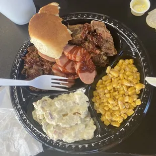 Chopped brisket, sliced brisket, beef sausage, butter corn and potato salad (3 Meats, 2 Sides &amp; Roll).