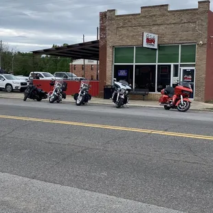 motorcycles parked in front of a restaurant