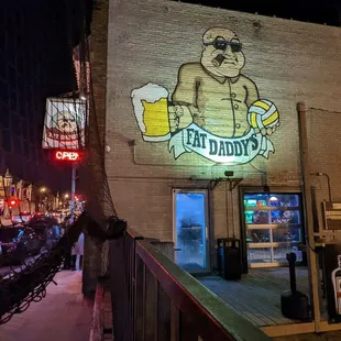 a man holding a glass of beer