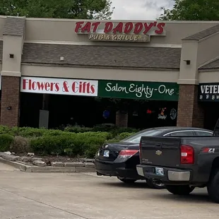 a pickup truck parked in front of the restaurant