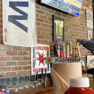 a man pouring a beer