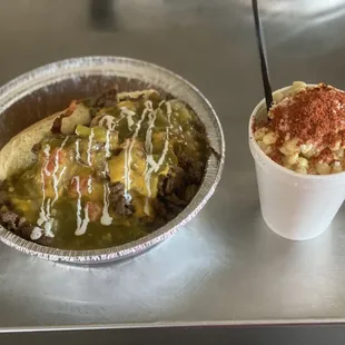 This is our Carne Asada and Green Chile Queso covered Bacon Wrapped Deep Fried Hotdog. Beside it is our Vaso De Elotes