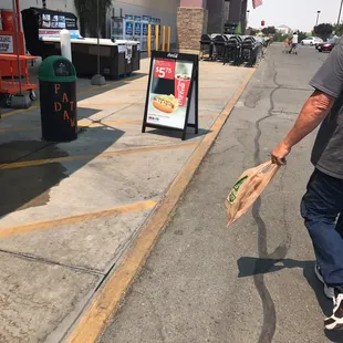 a man carrying a bag of food