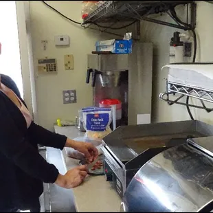 Since it was just after opening time and the grill wasn't lit, Jennifer got some tri-tip from the fridge, and sliced it for my tacos.