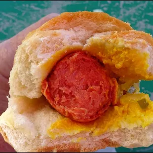 Here's a cross section of a "Jumbo Dawg," showing the amazing mustard, dill relish and diced onion, all wrapped up in a large roll.