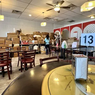 the inside of a restaurant with tables and chairs