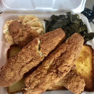 Two pieces fish dinner with Mac and Cheese and Collar greens