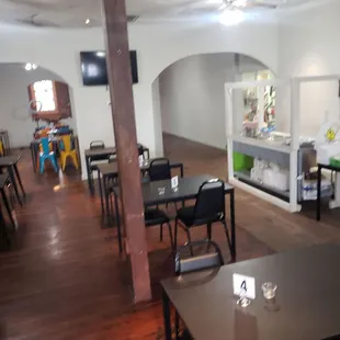 a restaurant with tables and chairs