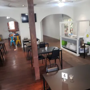 a restaurant with tables and chairs