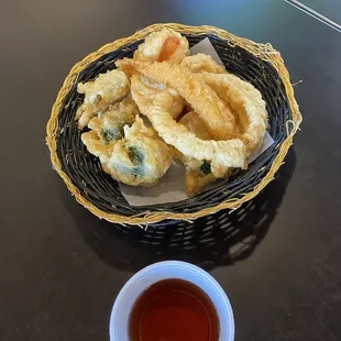 tempura appetizer with one shrimp and vegetables.