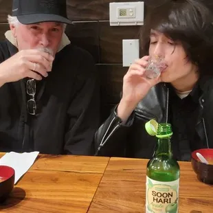 Father and son are taking a shot of saki for my son 22nd birthday!