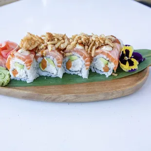 a plate of sushi on a white table