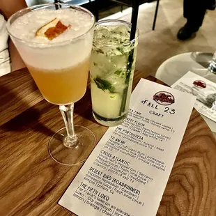 two cocktails on a wooden table