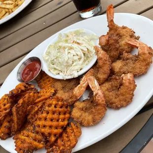 Fried shrimp with sweet potato fries.