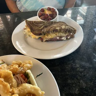 Rueben sandwich on marbled rye with fresh fruit