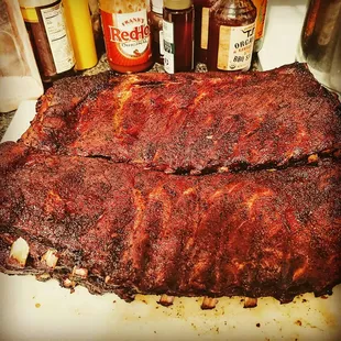 two ribs on a cutting board