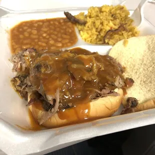 Bbq pulled pork sandwich, baked beans , rib-tip perlo rice