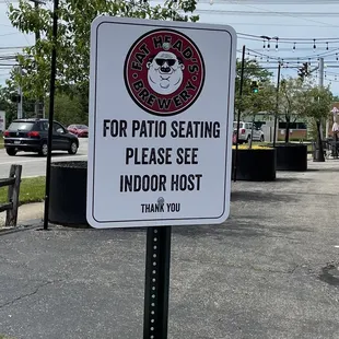 a sign for patio seating