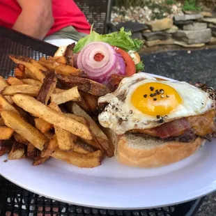 Classic bacon cheeseburger with sunny side up egg