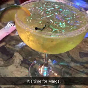 a cocktail in a martini glass with the words friday on it