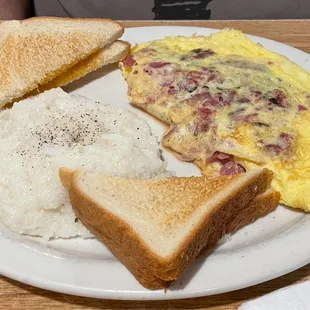 Omelette with 1/2 pastrami and 1/2 corned beef and grits